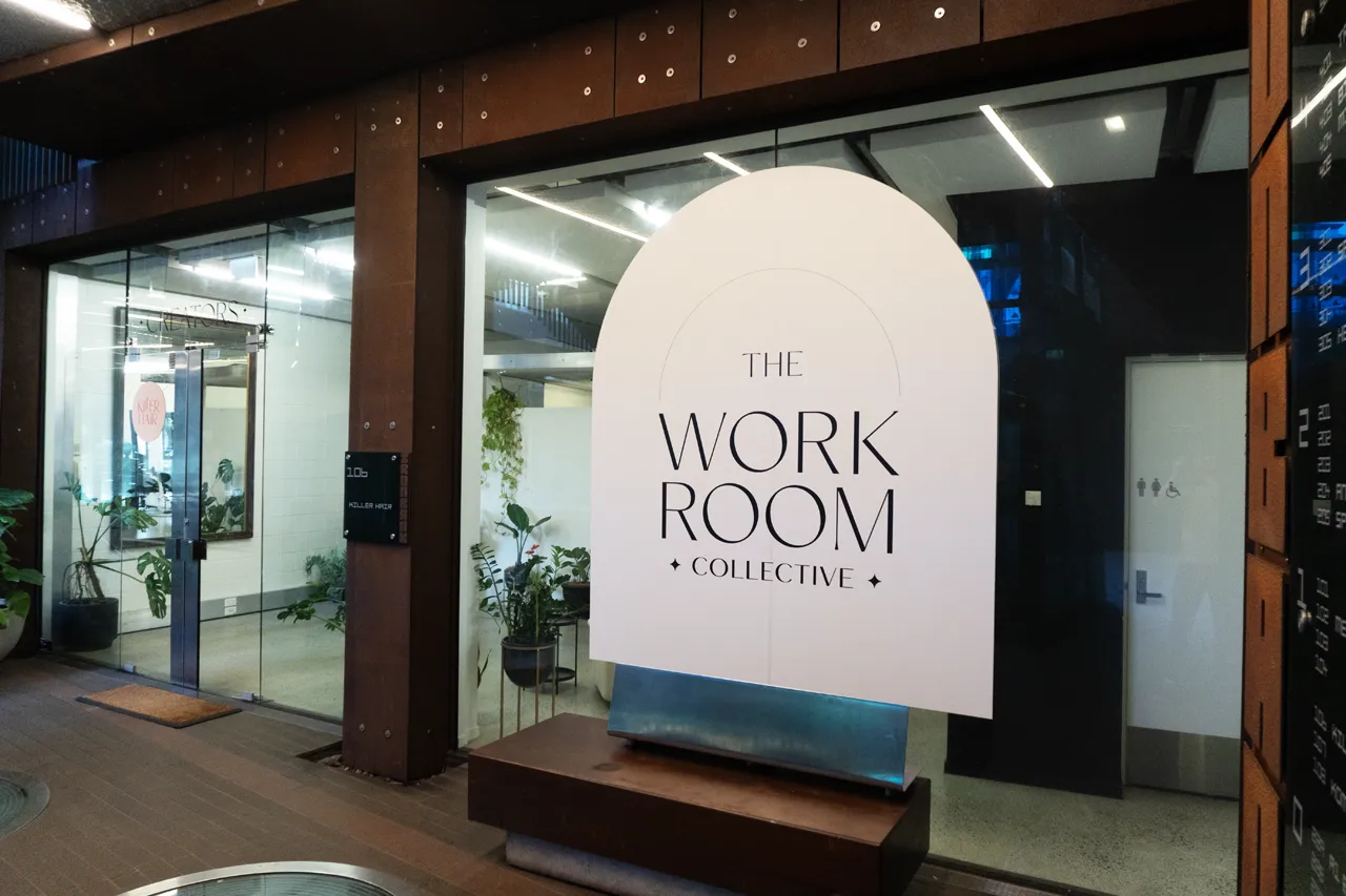 The Workroom Collective arched sign in the studio glass frontage