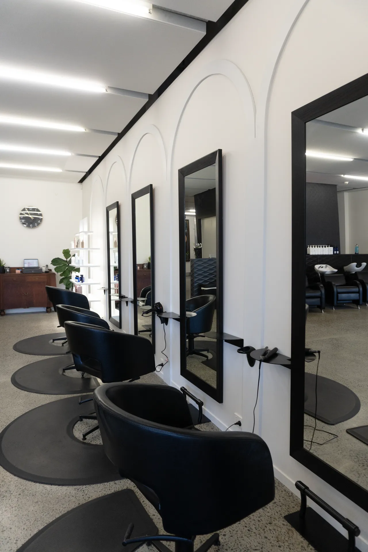 Styling chairs along the arched feature wall