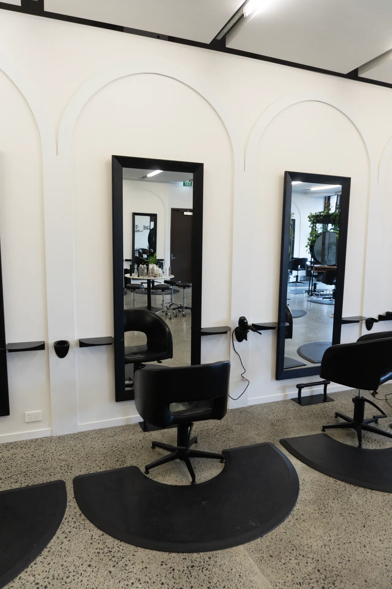 Styling mirrors along the arched feature wall