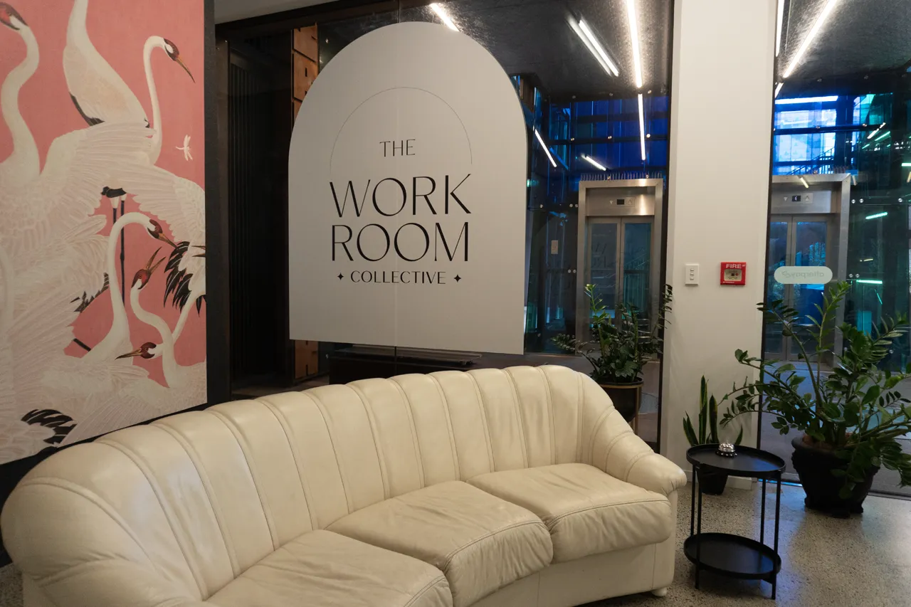 The flamingo-mural lounge with a white sofa